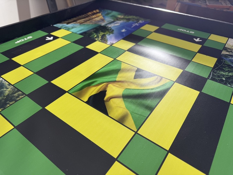 Close-up of the Jamaican flag center and colored spaces on a ludi board